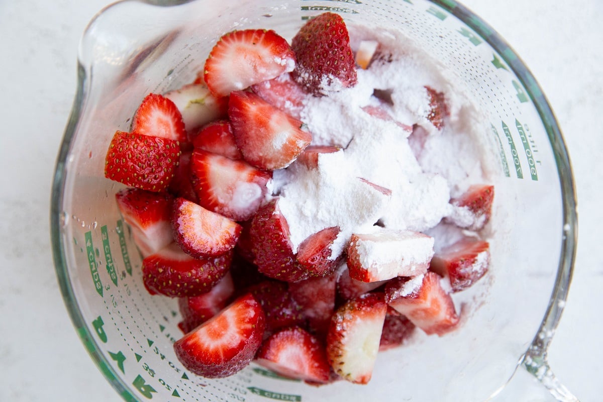 Strawberries, pure maple syrup and tapioca flour in a big measuring cup.