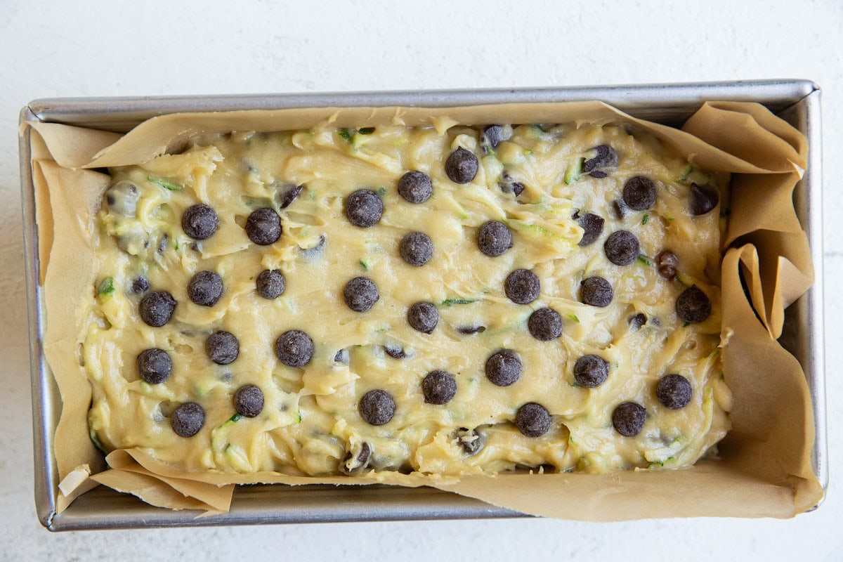 Zucchini bread batter in a loaf pan, ready to bake.