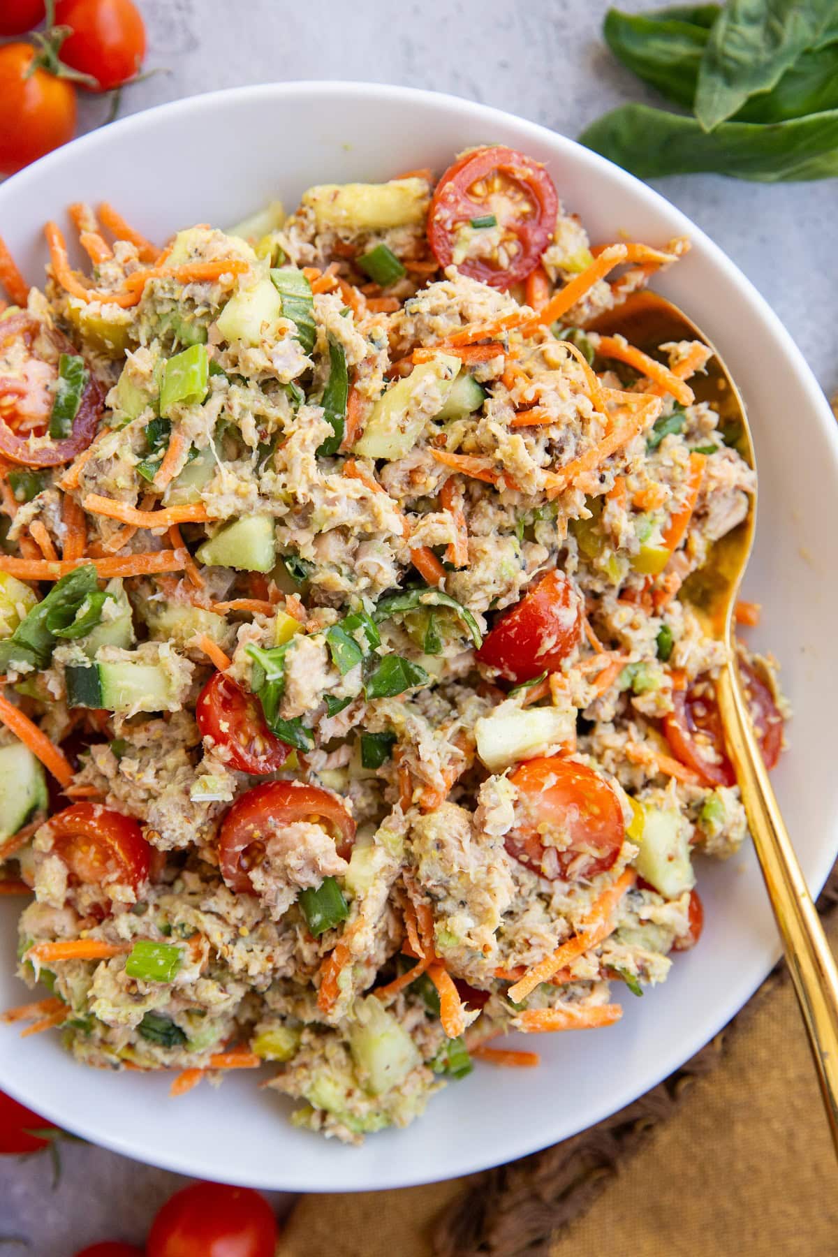 Salmon salad with carrots, tomatoes, cucumbers, and more.