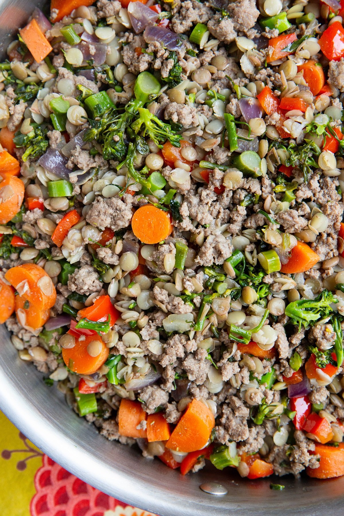 Close up of ground beef, lentils, and vegetables in a skillet. Ready to eat.