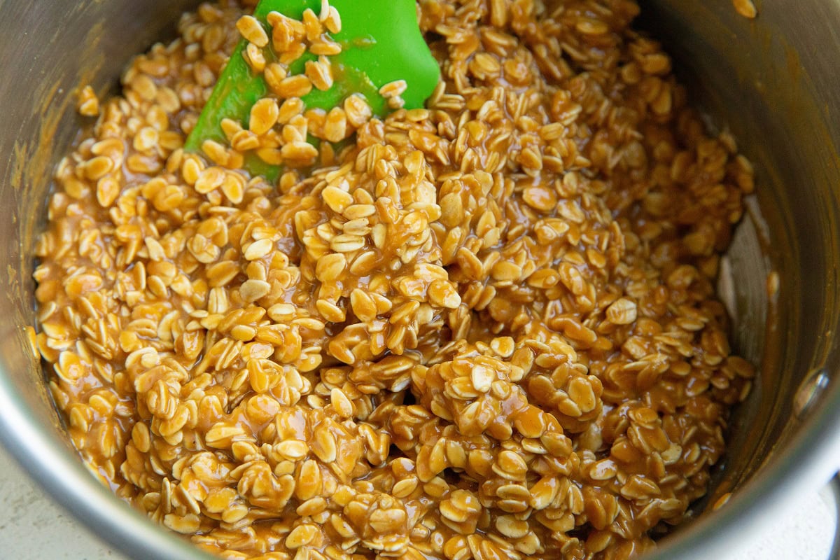 All of the ingredients for no-bake oatmeal cookies mixed up in a saucepan, ready to turn into cookies.