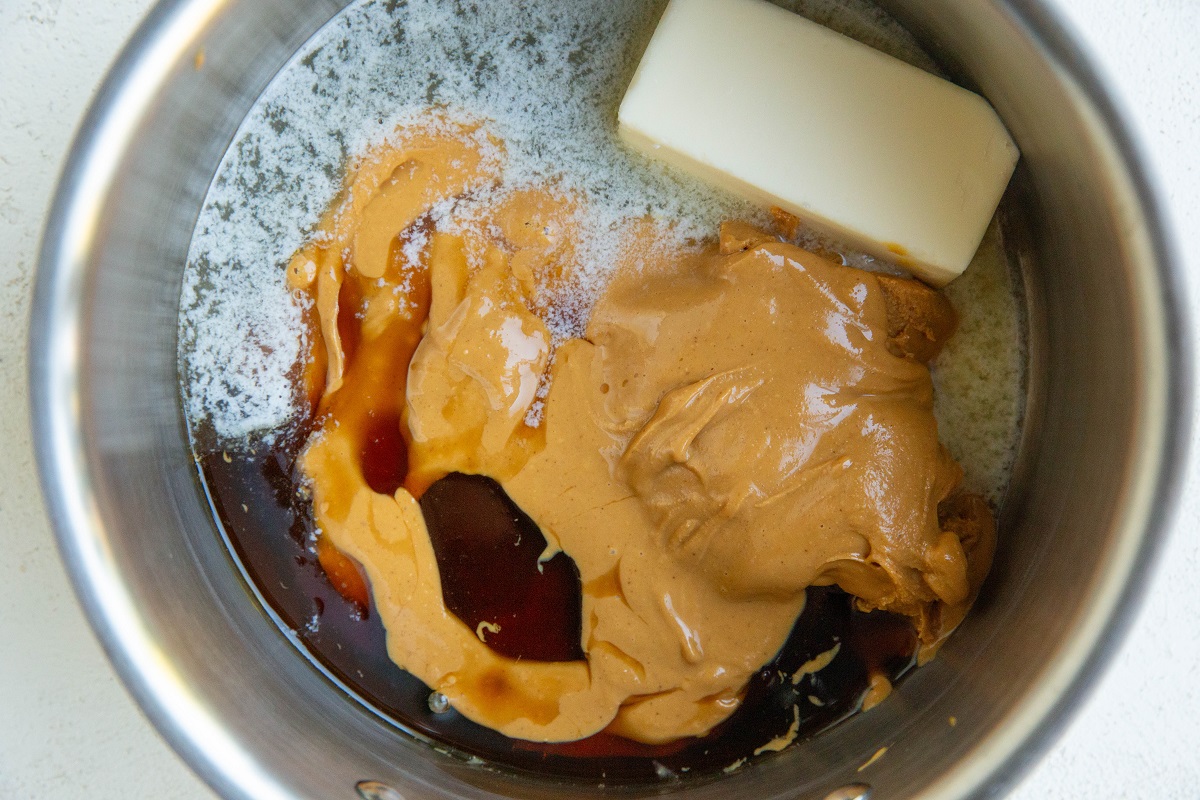 Butter, peanut butter, and pure maple syrup in a sauce pan for no-bake cookies.