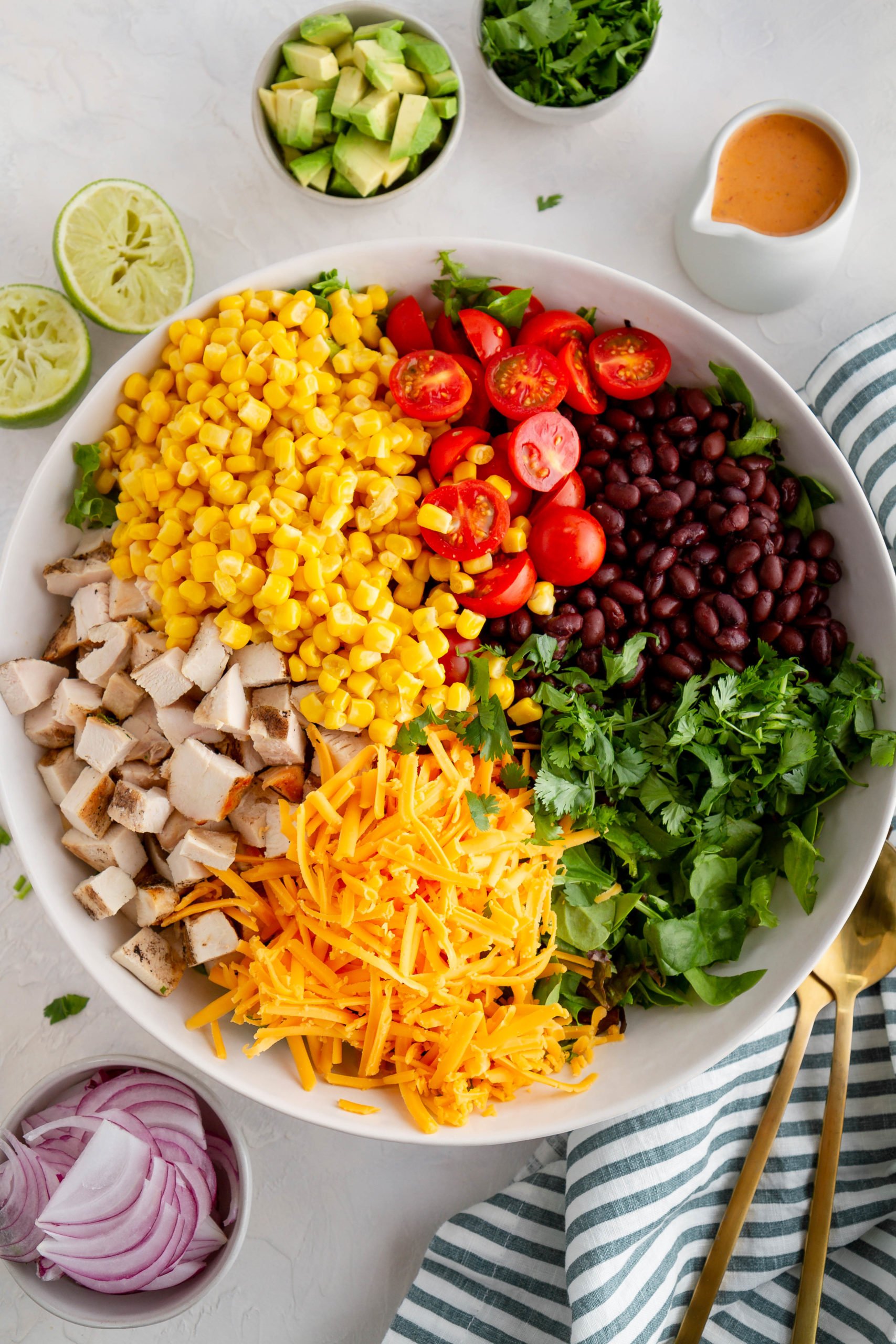 Ingredients for Southwest chicken chopped salad in a mixing bowl.