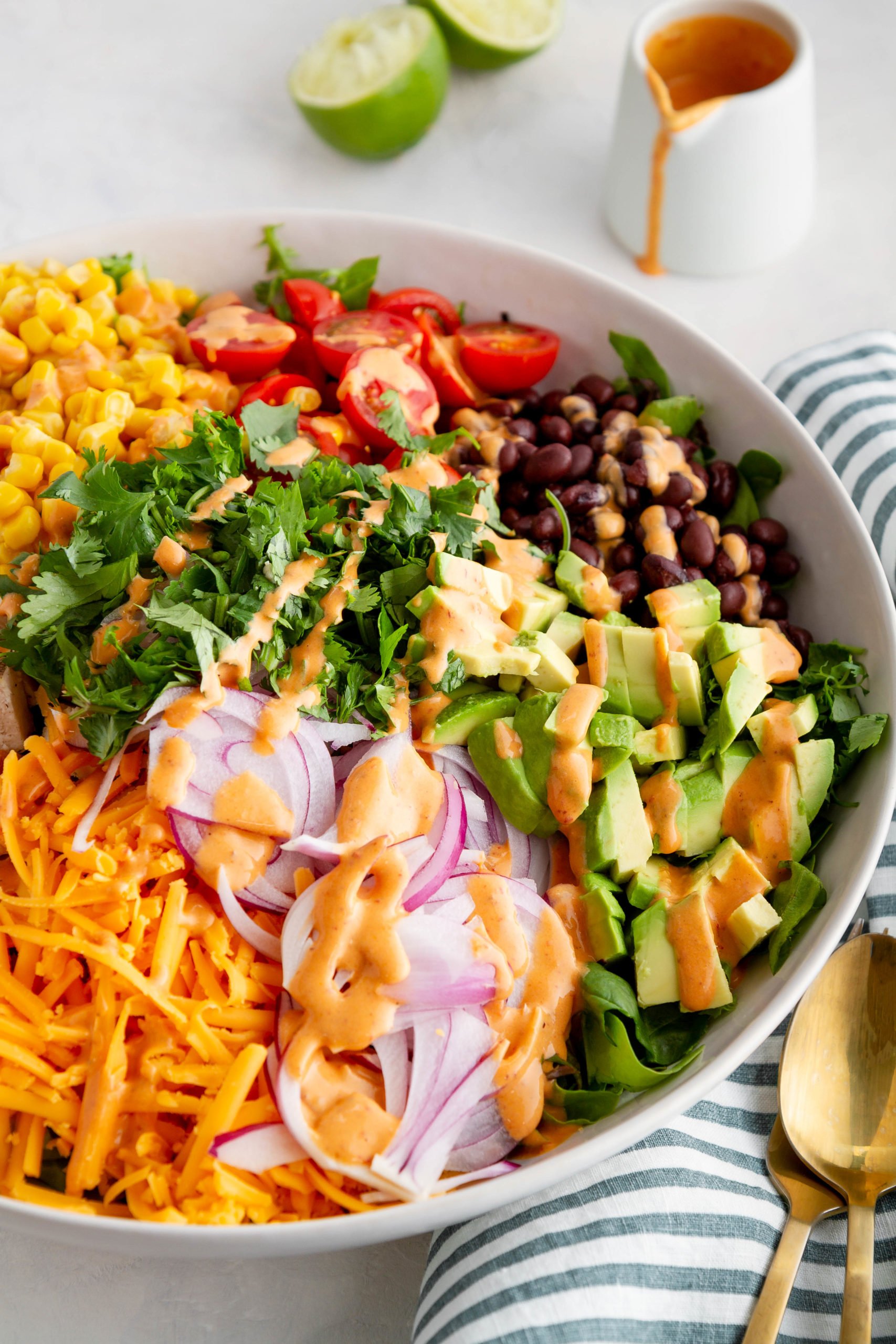 Southwest chopped salad with dressing drizzled on top.