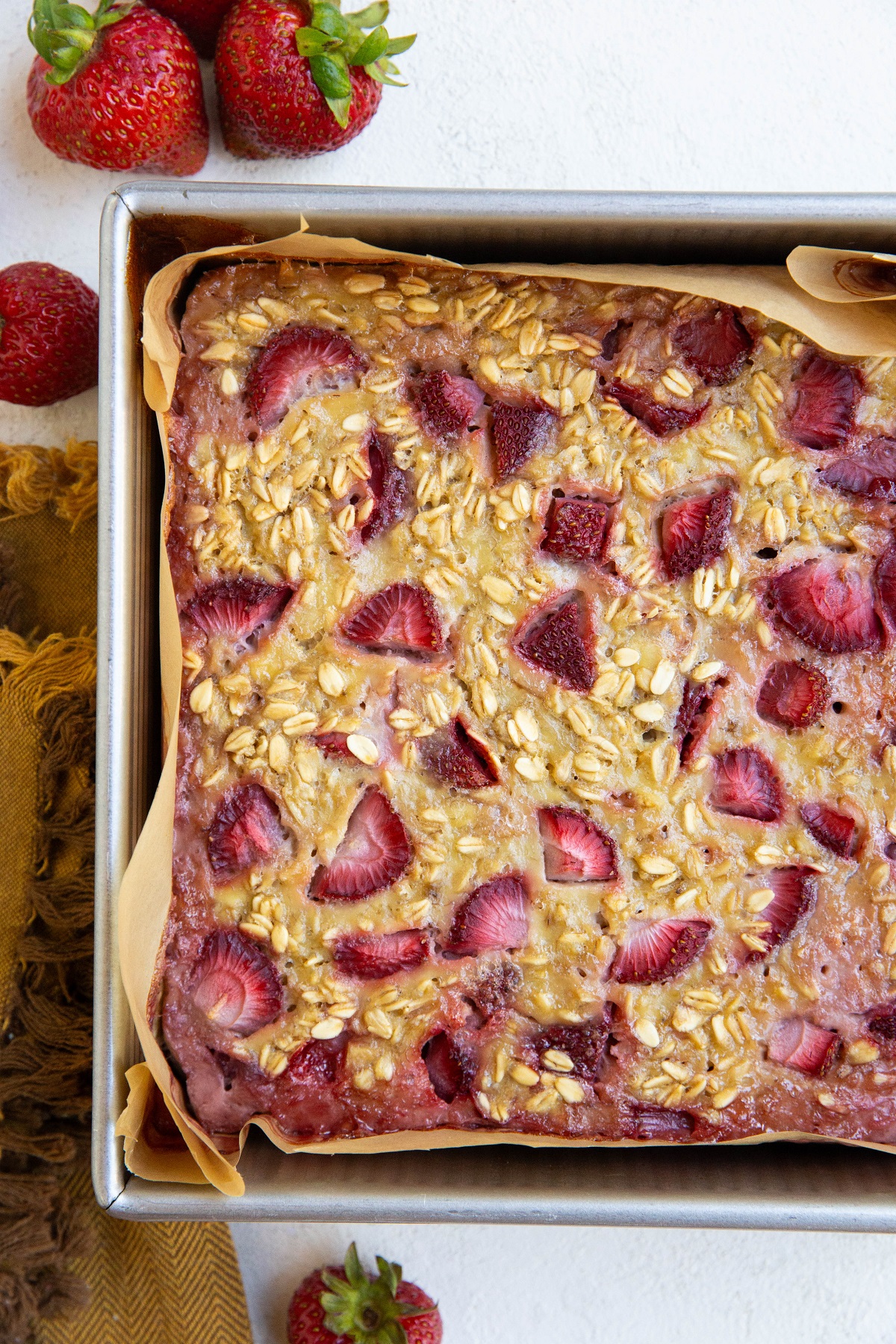 Baking pan with freshly baked strawberry baked oatmeal.
