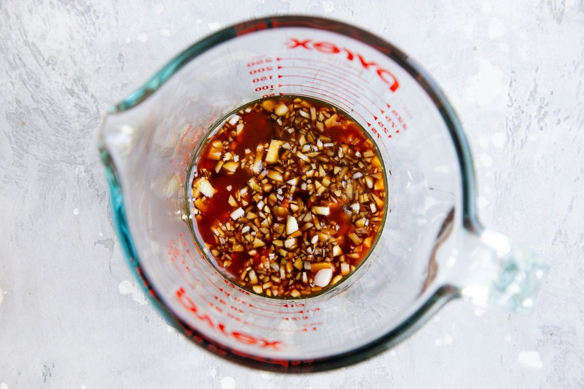 Marinade ingredients in a measuring cup.