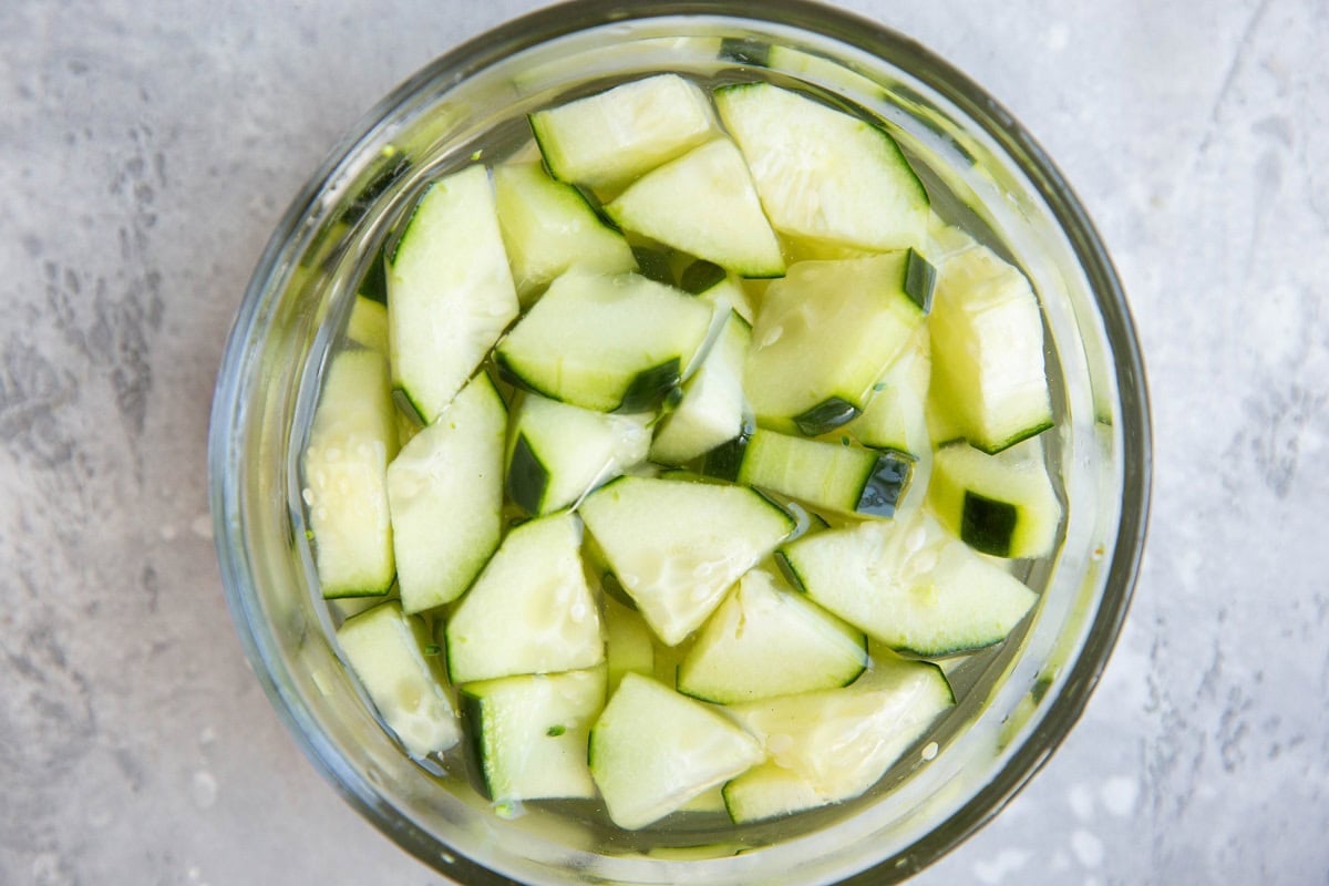 Pickled cucumbers in a bowl, ready to eat.