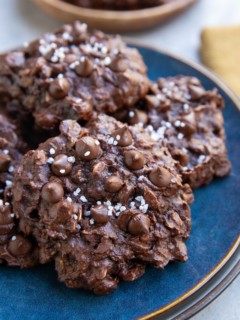 Double chocolate oatmeal cookies on a blue plate, ready to serve.