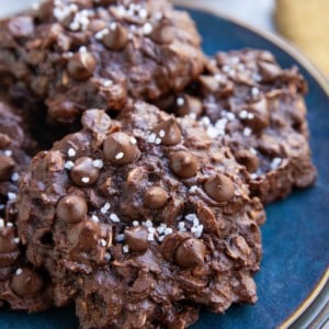 Double chocolate oatmeal cookies on a blue plate, ready to serve.