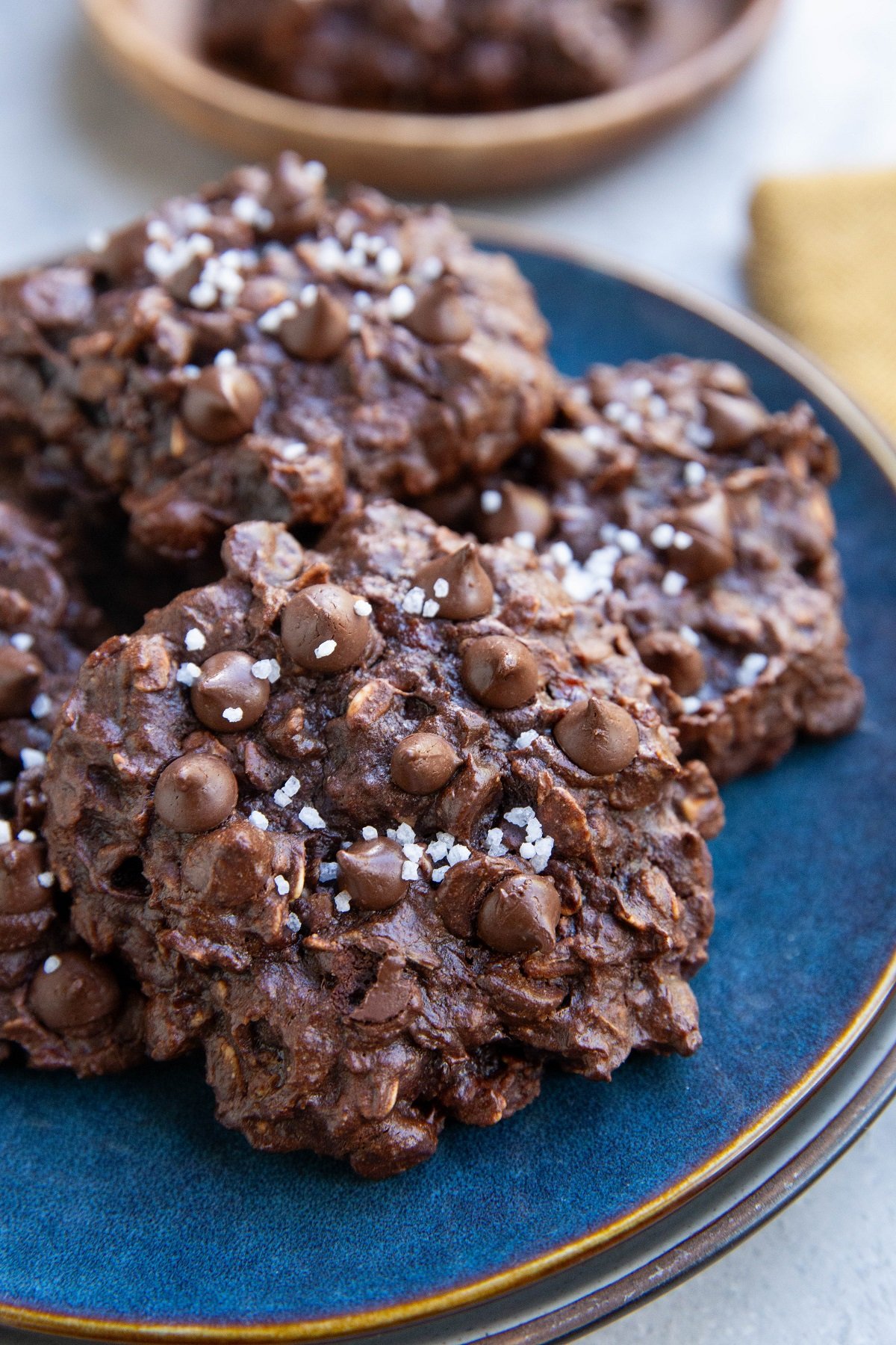 Double chocolate oatmeal cookies on a blue plate, ready to serve.