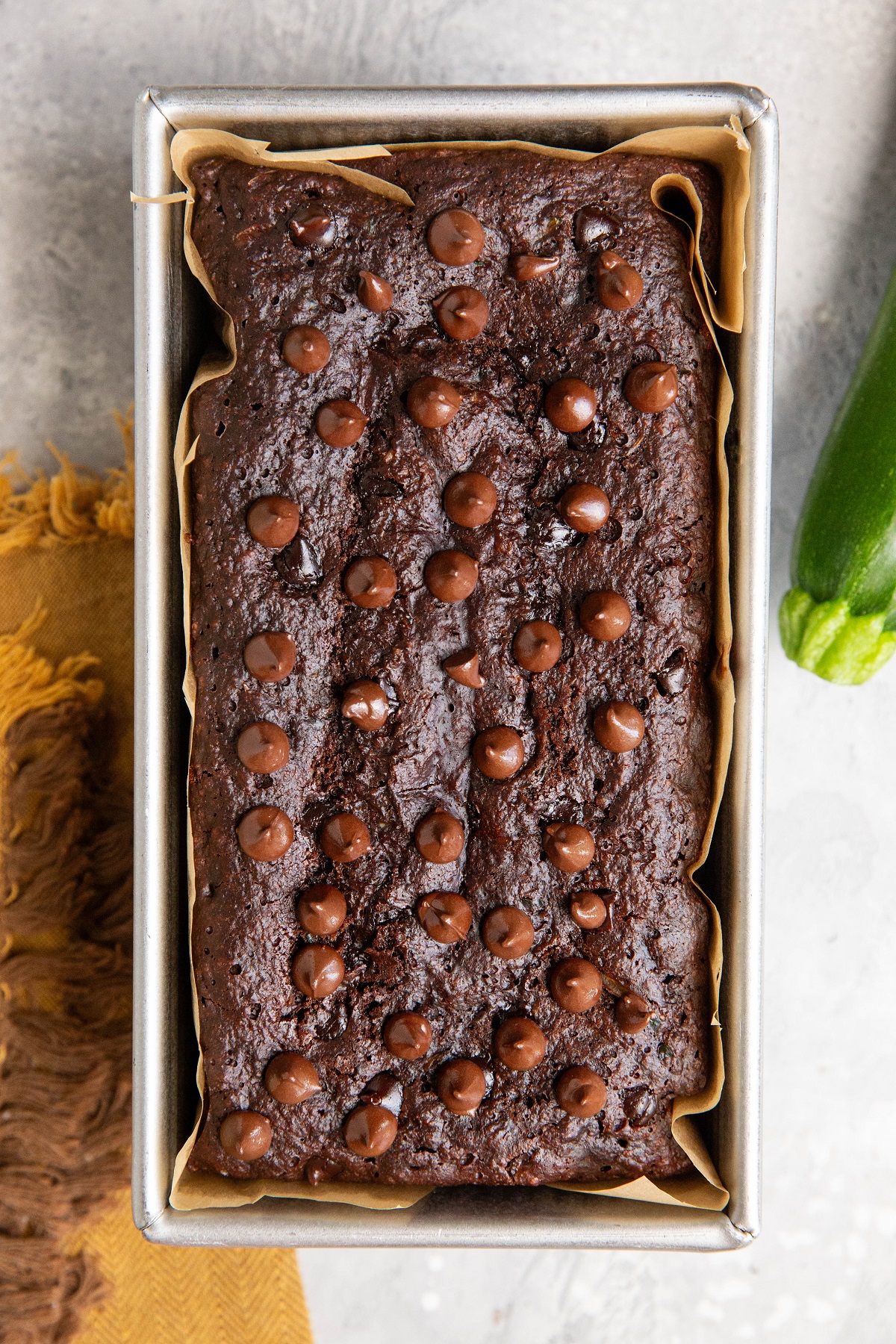 Loaf pan of double chocolate chip zucchini bread.