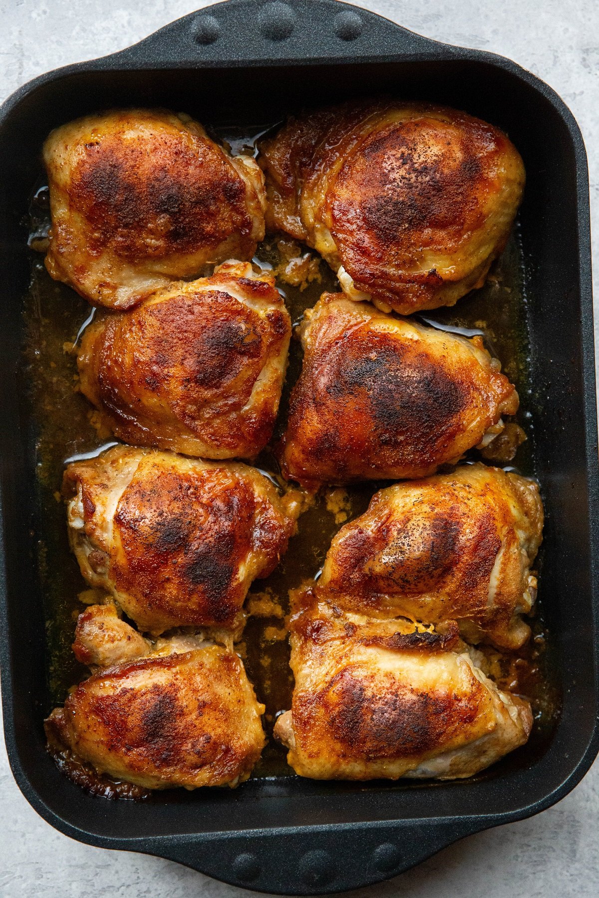 Roasting pan full of bon in chicken