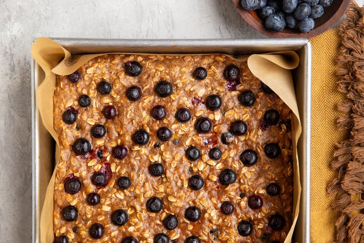 Blueberry oatmeal bars fresh out of the oven in a baking pan.