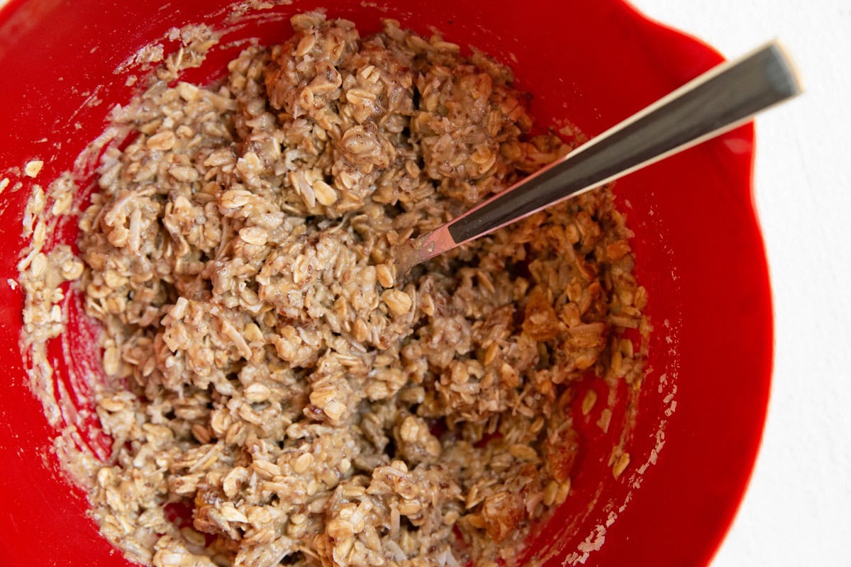 Aussie bite mixture in a mixing bowl, ready to be baked.