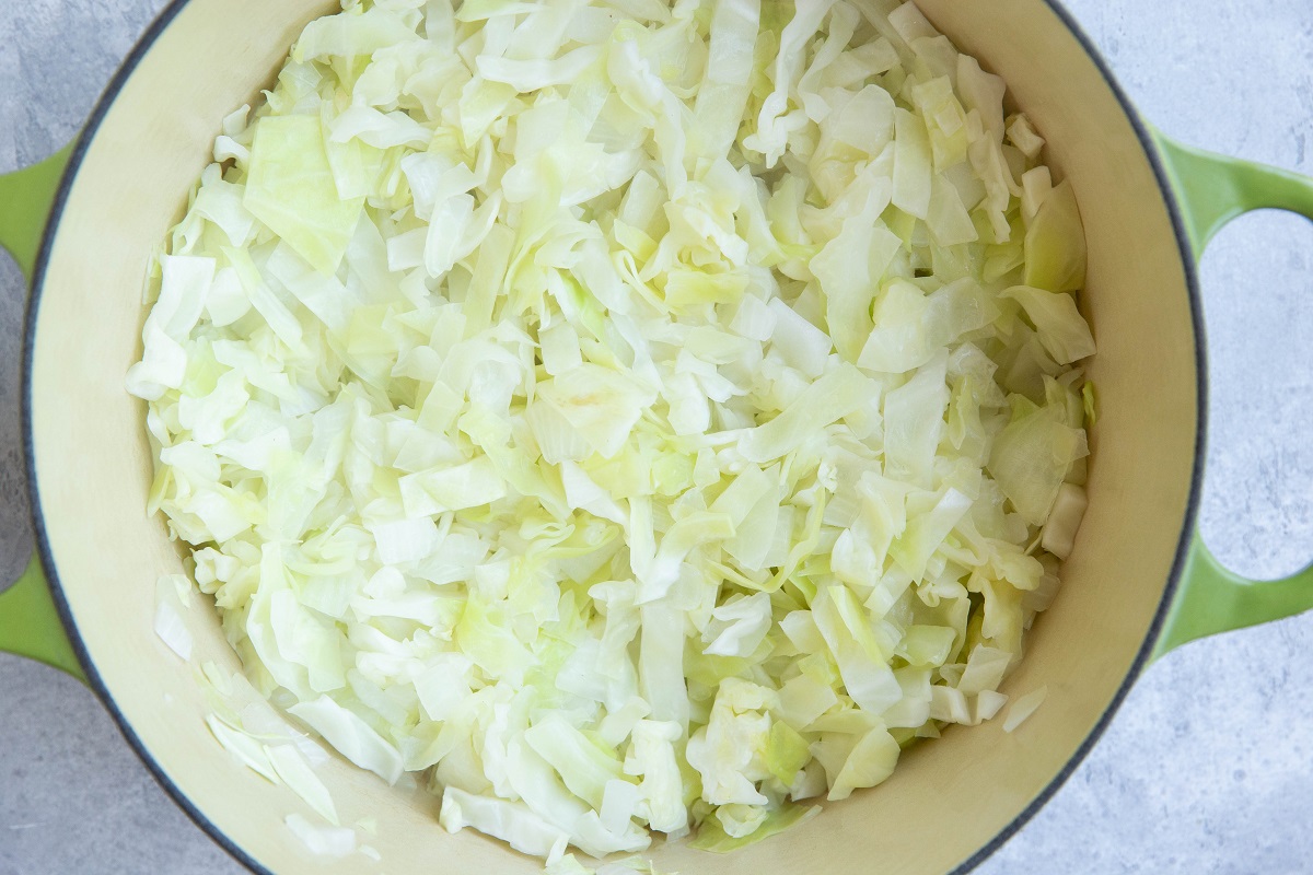 cabbage sautéing in a large pot