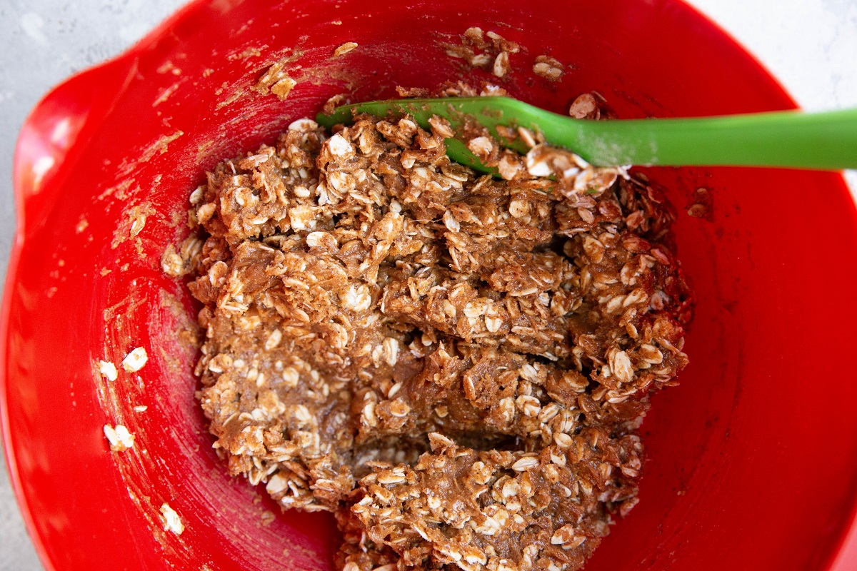 Peanut butter, oats and pure maple syrup mixed up in a mixing bowl.