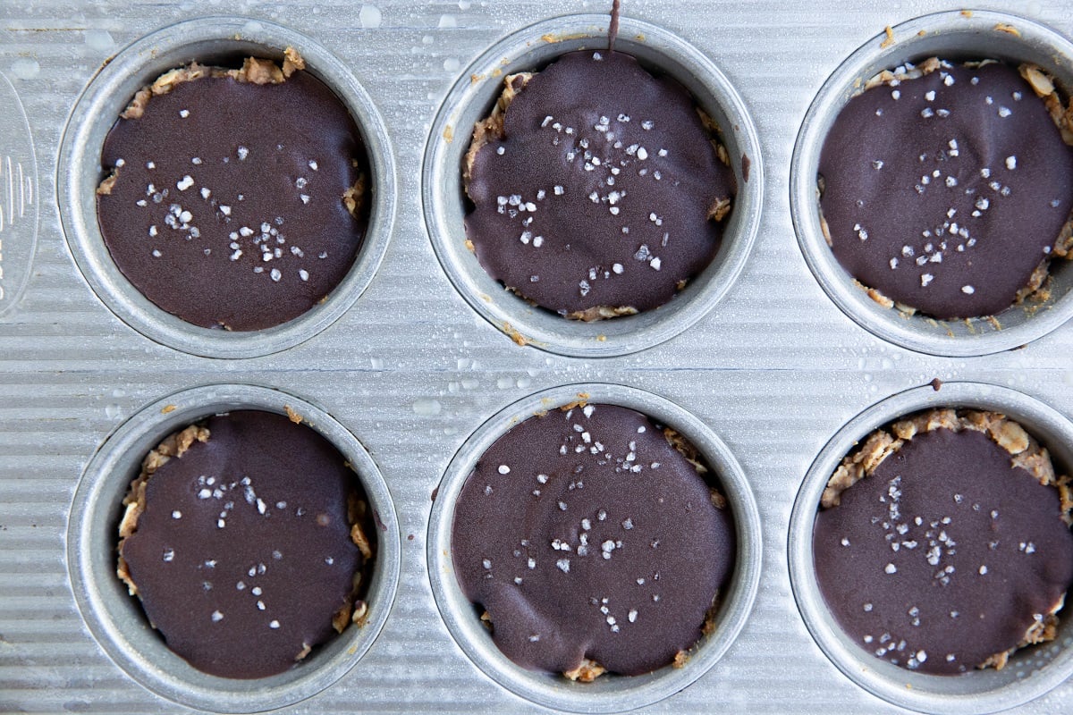 Finished peanut butter oatmeal cups all set up in a muffin tray.