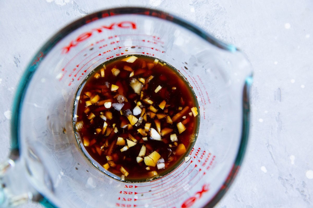 Ingredients for homemade teriyaki sauce in a measuring cup.