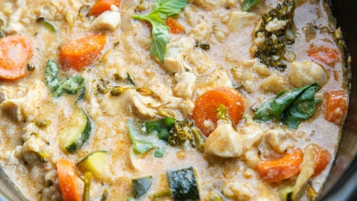 Slow cooker full of chicken curry with vegetables.