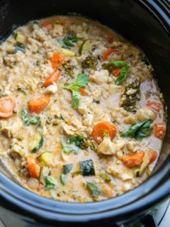 slow cooker full of Thai curry with chicken and vegetables.