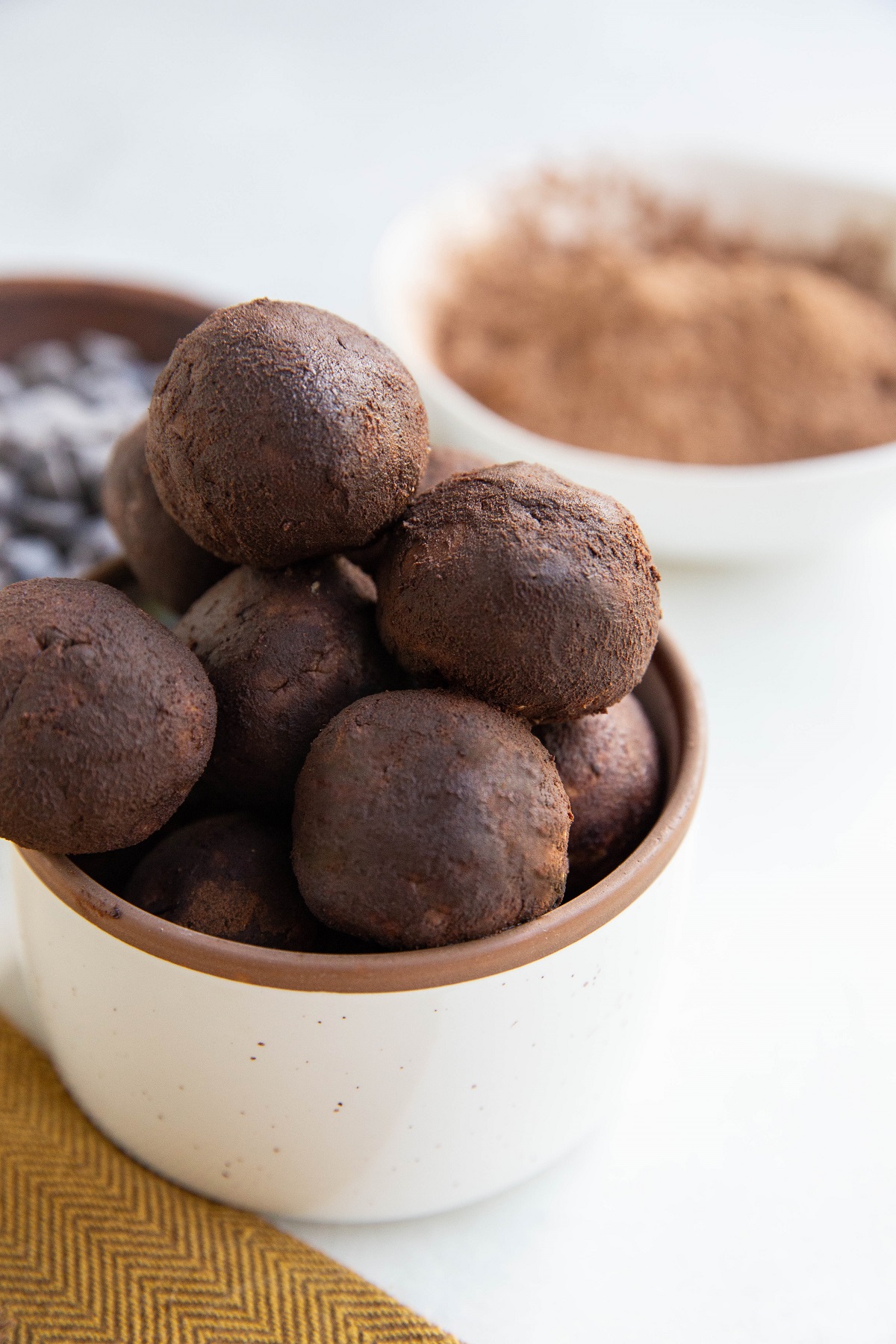 Bowl of fudge brownie protein bites, ready to eat.