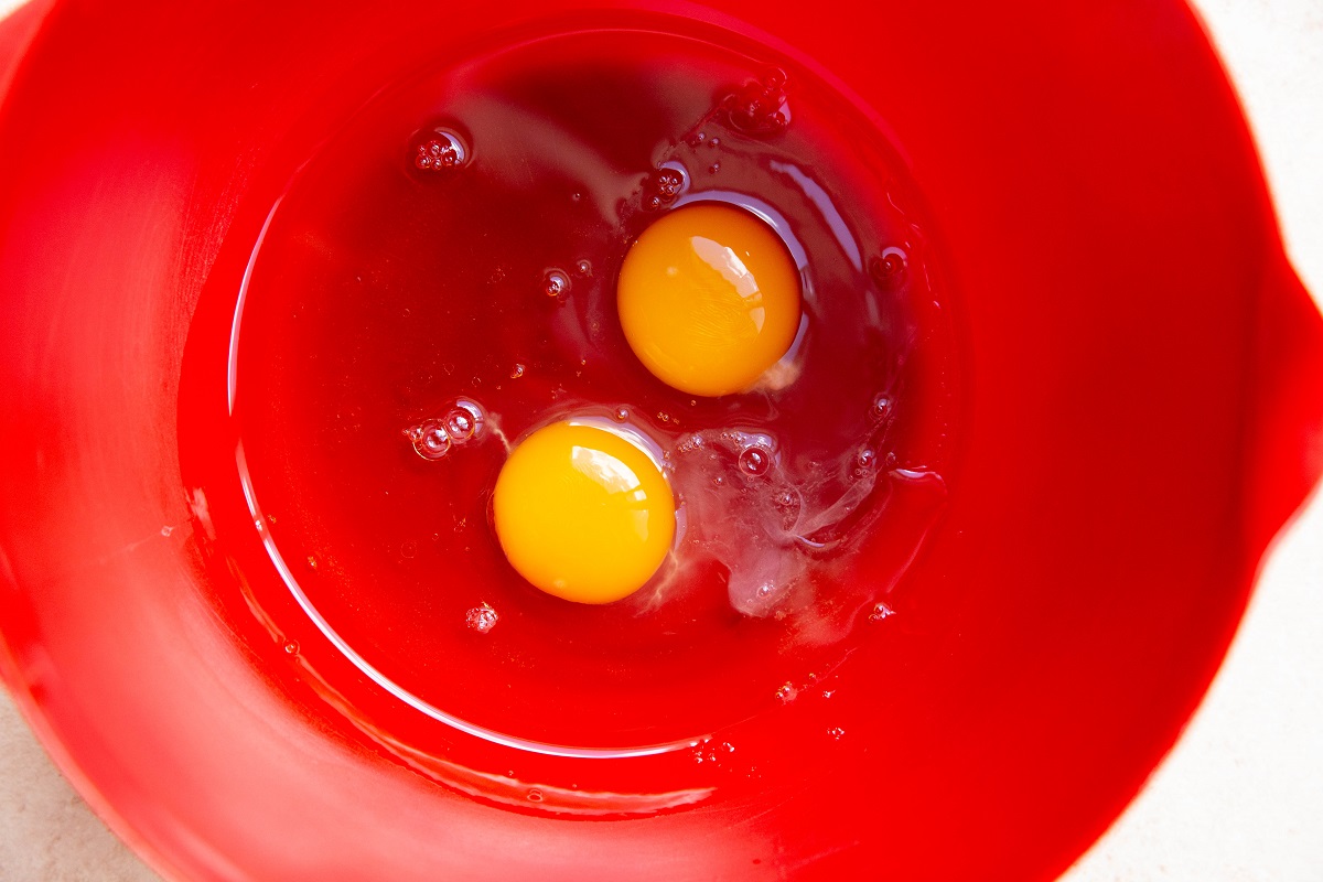 Wet ingredients for muffins in a mixing bowl.