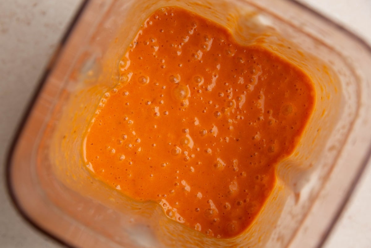 Roasted red pepper sauce in a blender.