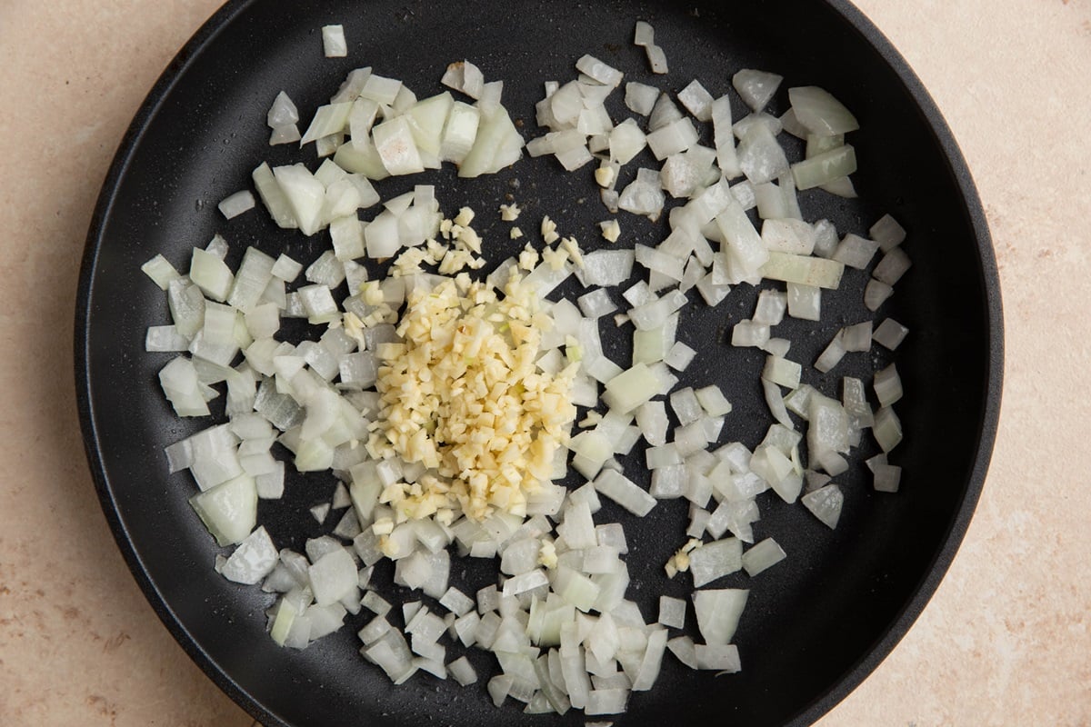 Sauteed yellow onion and garlic in a skillet