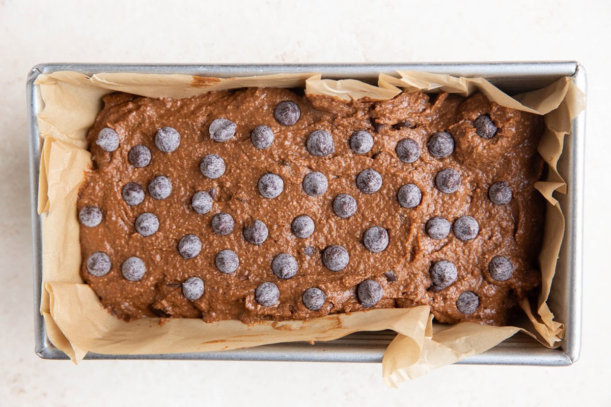 Chocolate pumpkin bread batter in a loaf pan, ready to bake.