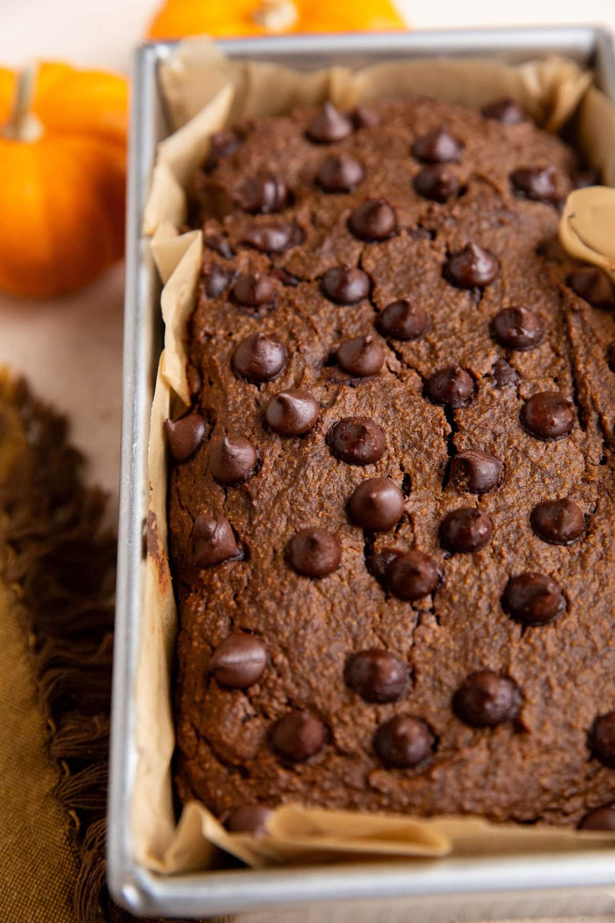 Chocolate pumpkin bread in a loaf pan, fresh out of the oven.