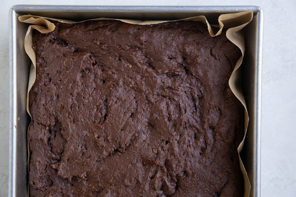 Finished sweet potato chocolate cake in a cake pan fresh out of the oven.