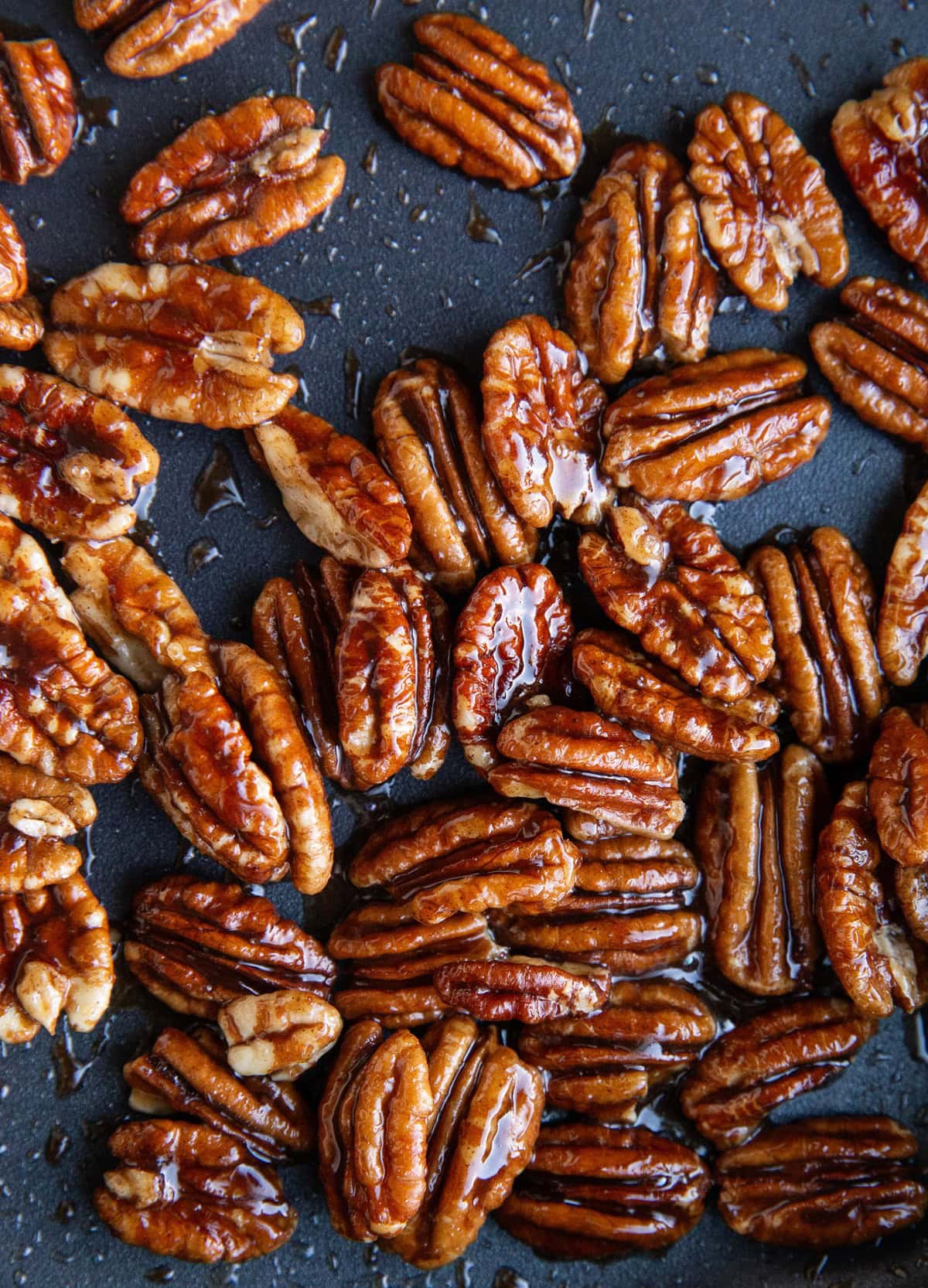 Candied pecans in a skillet, finished cooking.