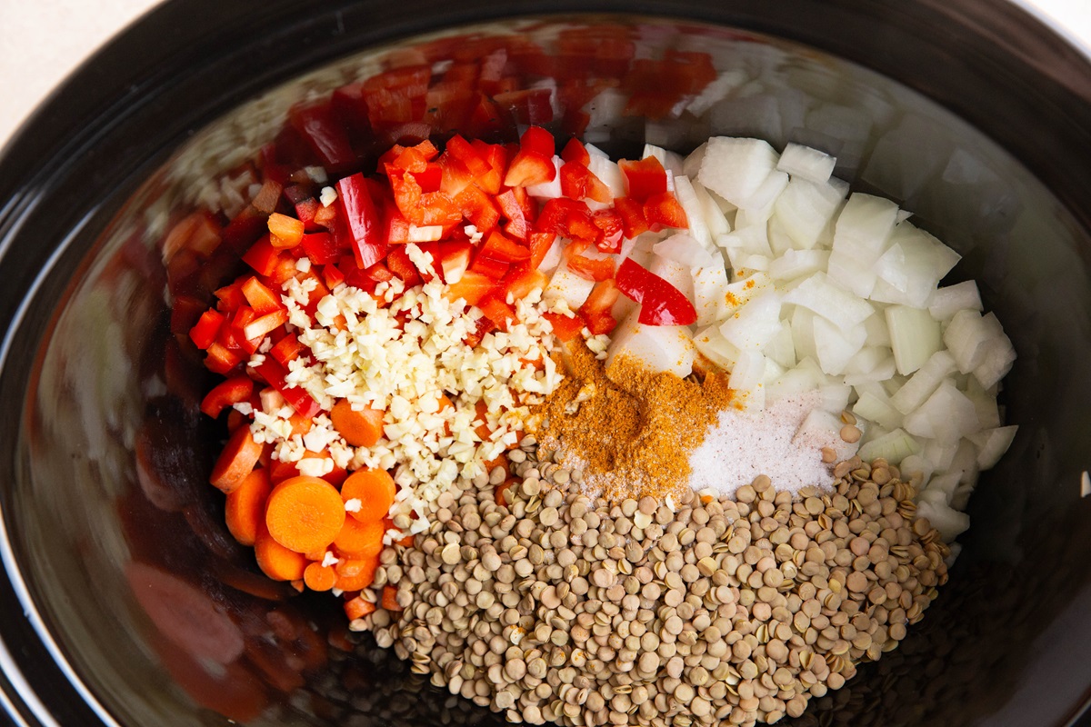 Ingredients for curry lentil soup in a crock pot