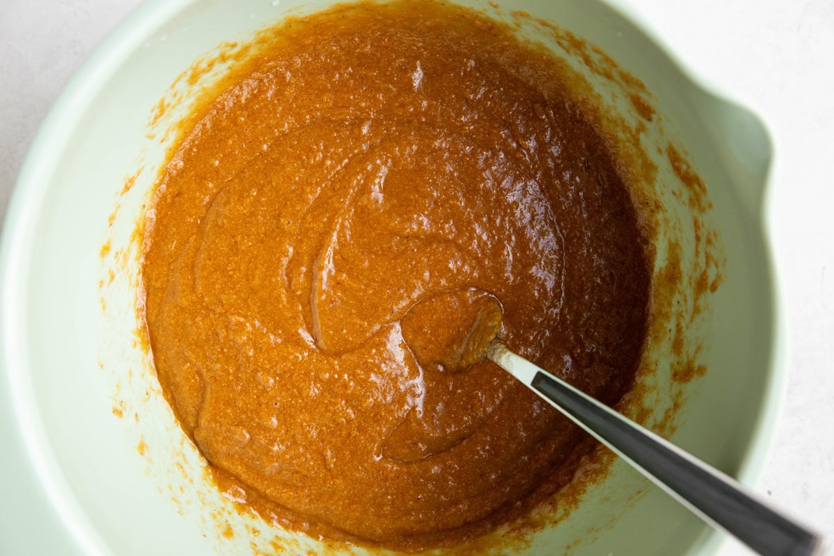 Wet ingredients in a mixing bowl to make double chocolate oatmeal bars.