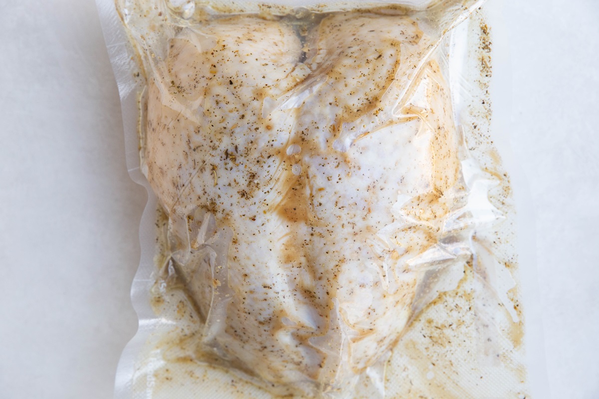 Bone-in turkey breast in a freezer bag with marinade.