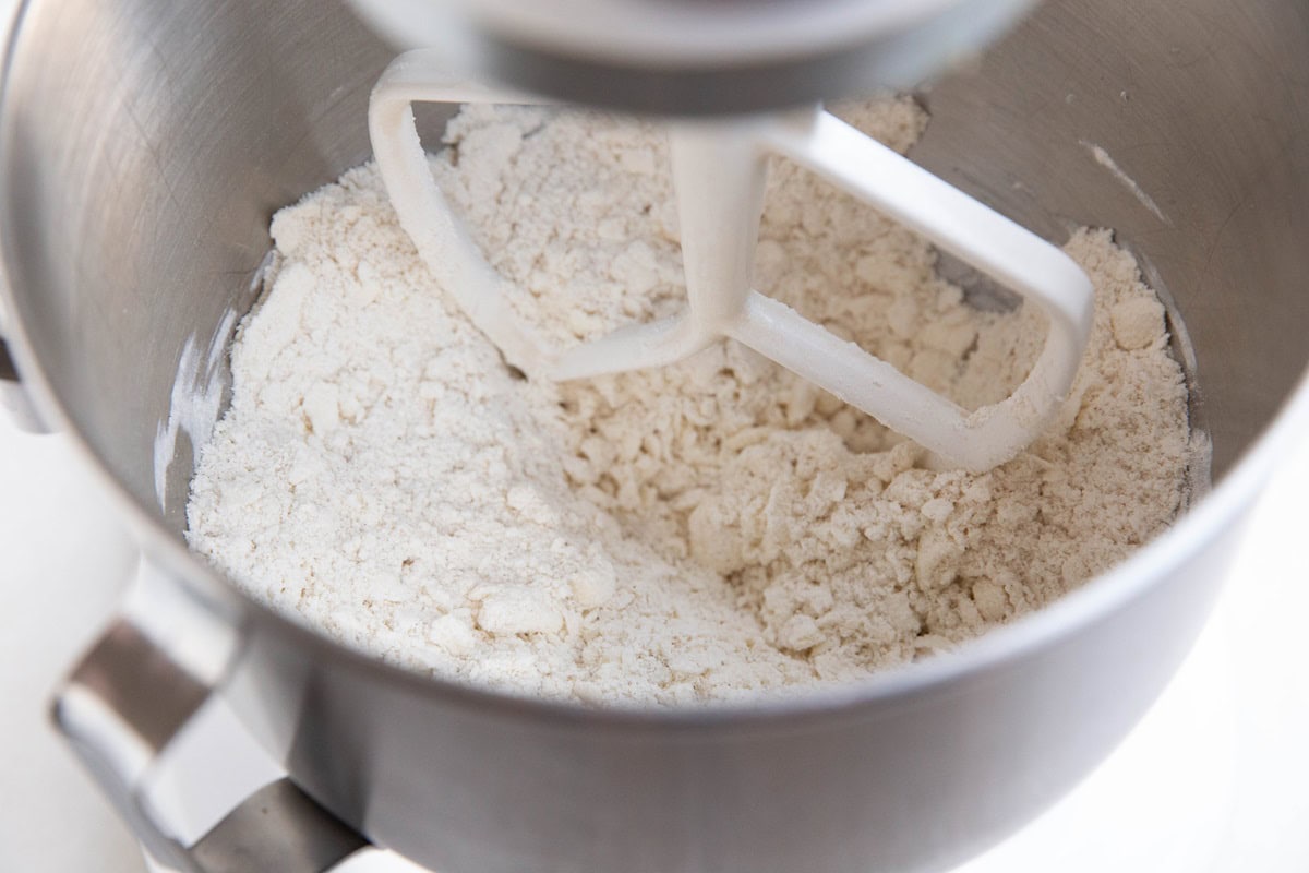 Pie crust mixture in a mixer.