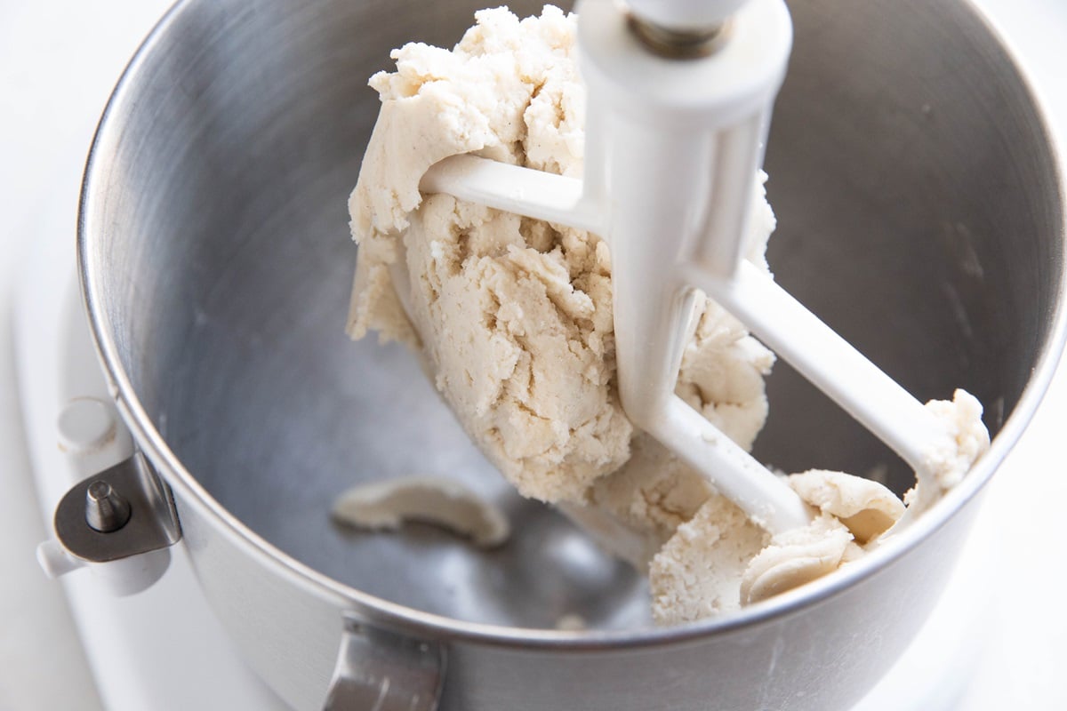 Stand mixer with pie dough.