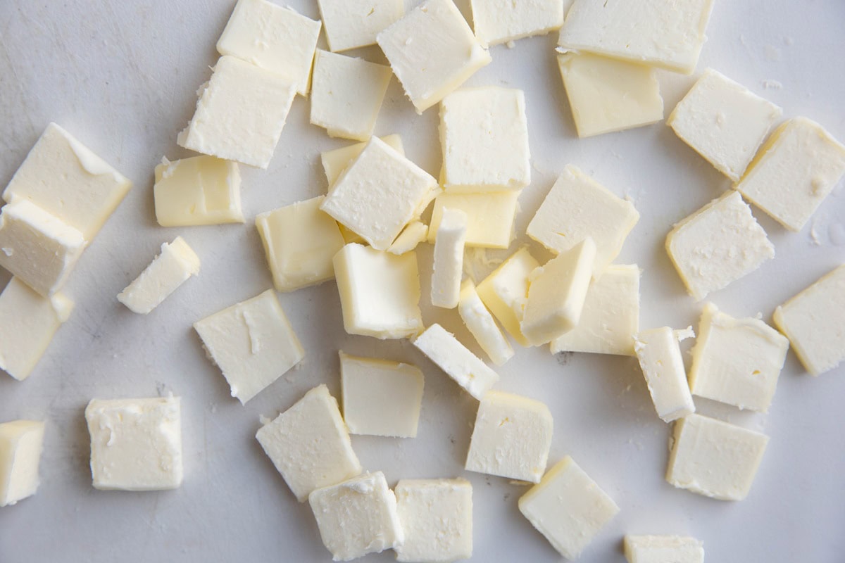 Cubes of butter on a cutting board.