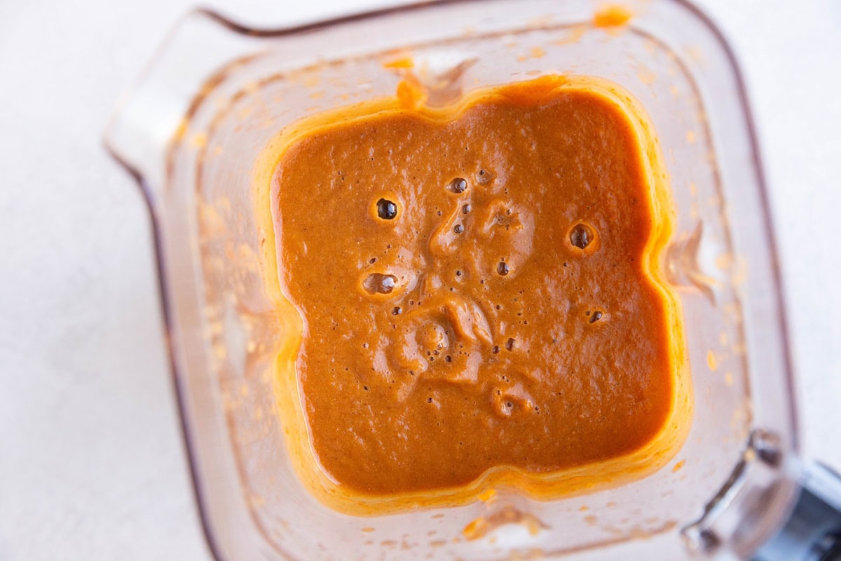 Pumpkin pie custard mixture in a blender.