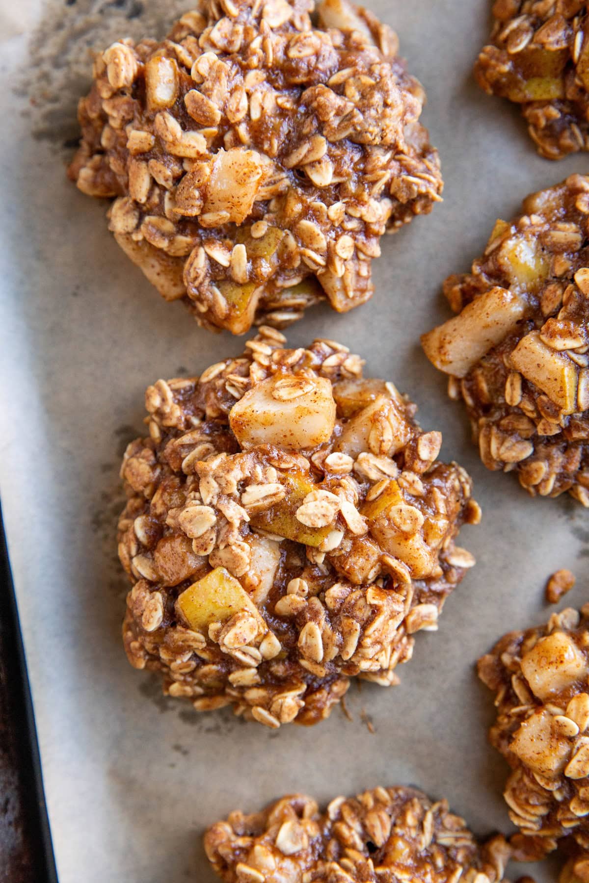 Pear oatmeal cookies on a baking sheet, fresh out of the oven.