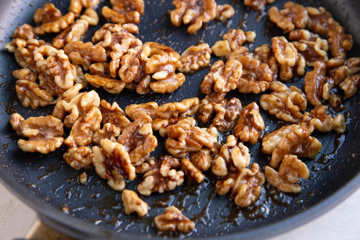 Candied walnuts in a skillet