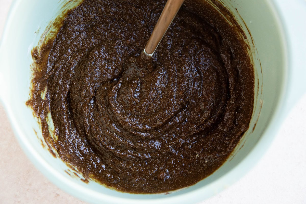 Gingerbread cake batter in a mixing bowl.