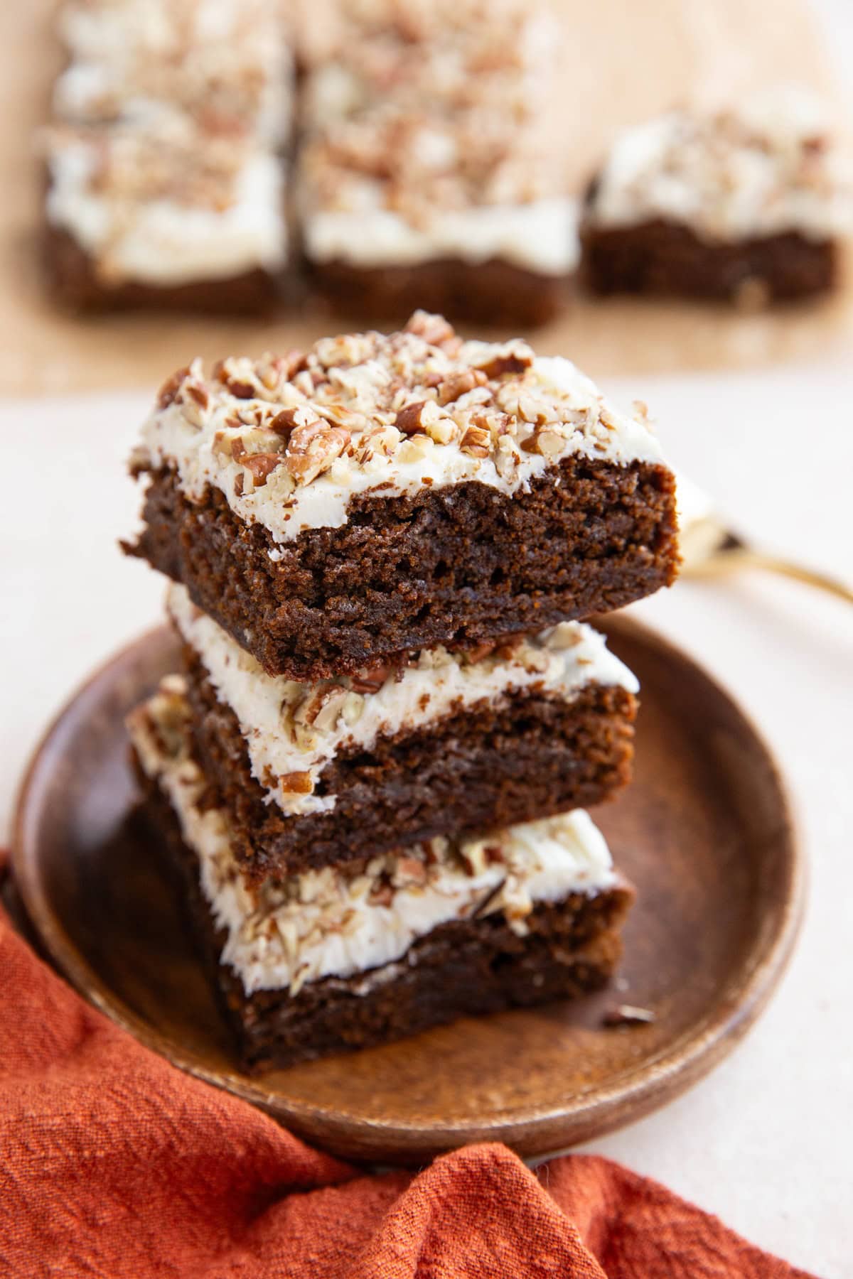 Stack of paleo gingerbread cake on a wooden plate.