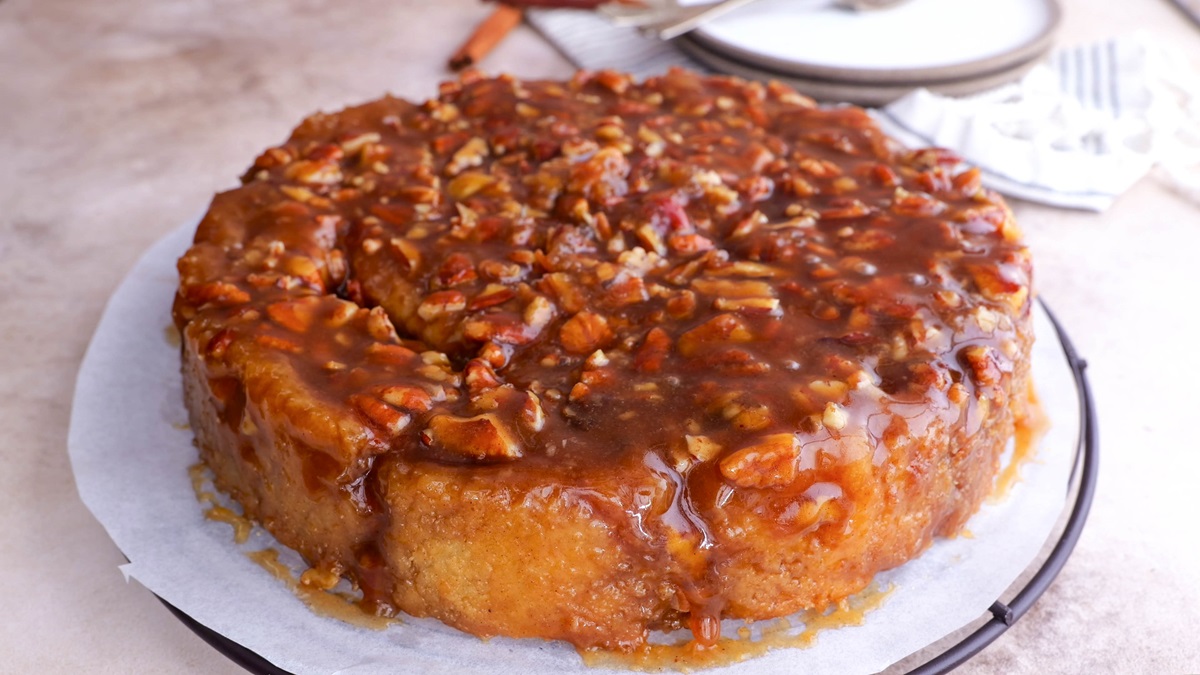 Serving plate with caramel sticky buns on top.