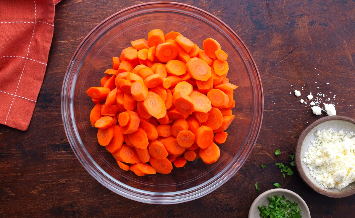 Raw carrots in a glass bowl.
