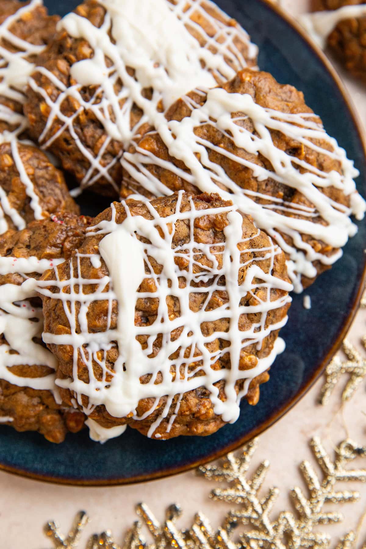 The easiest Christmas cookies on a blue plate with gold stars around to signify holiday decorations.