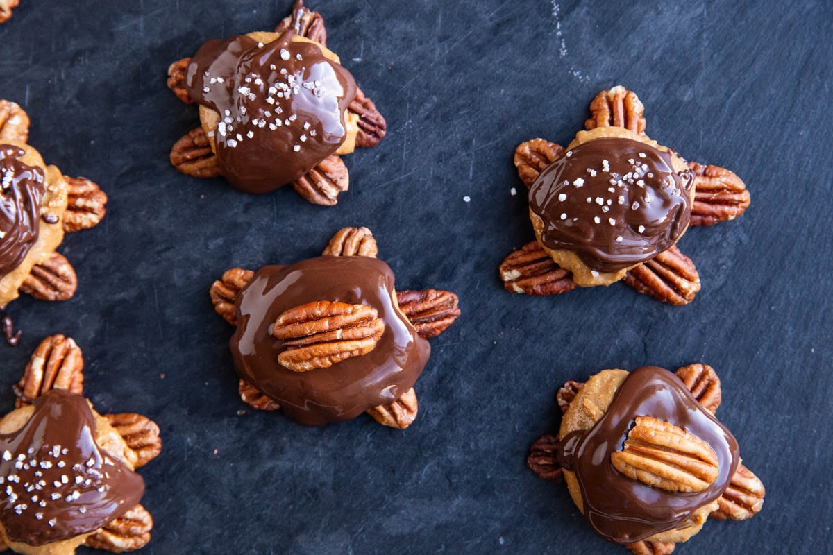 Pecan turtles drying to be used as Christmas candy.