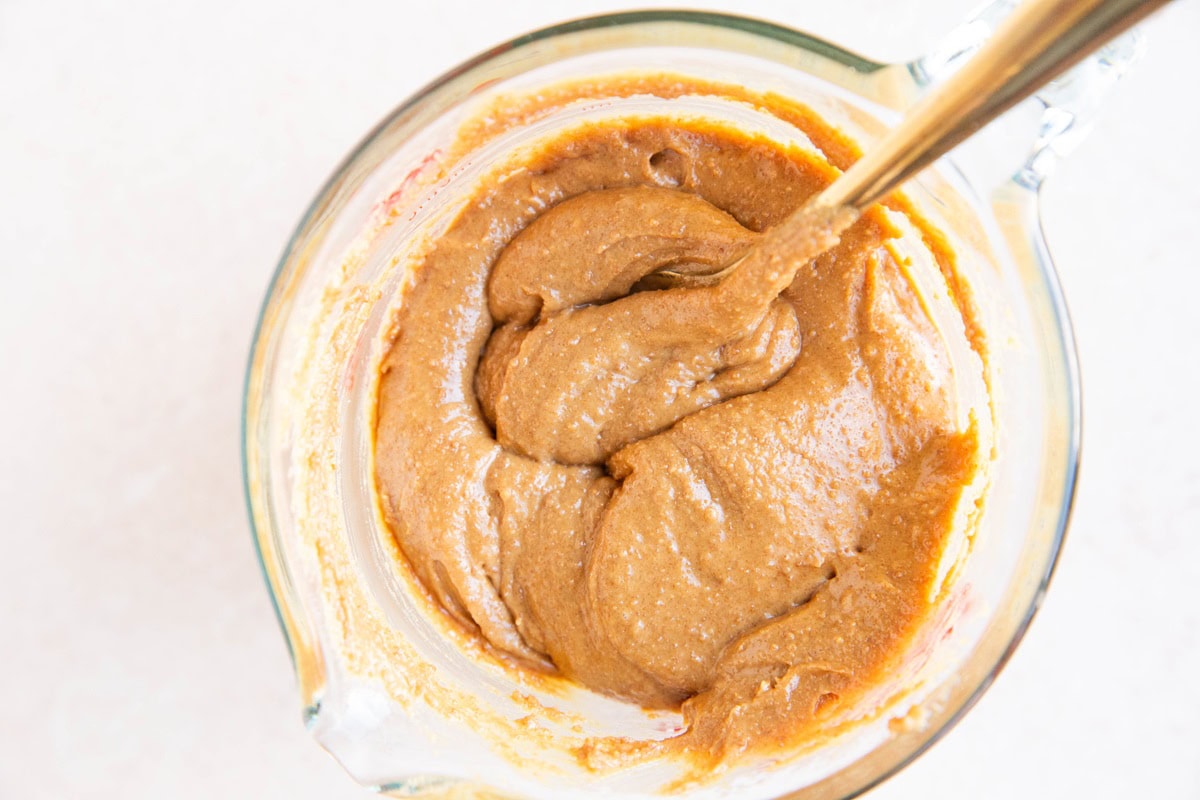 Peanut butter and powdered sugar mixed up in a bowl.