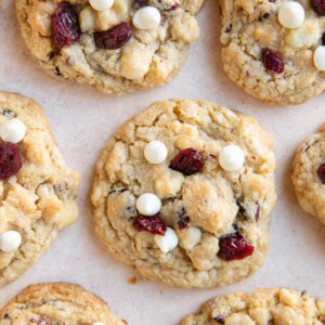 White chocolate macadamia nut cookies sitting on a background, ready to eat.