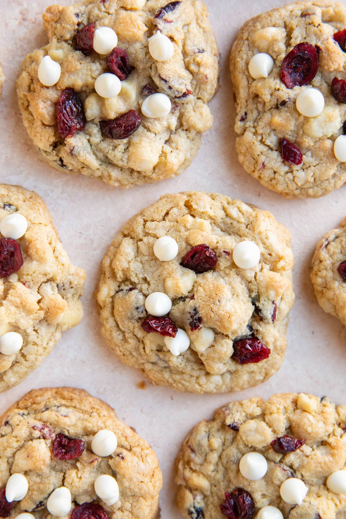 White chocolate macadamia nut cookies sitting on a background, ready to eat.